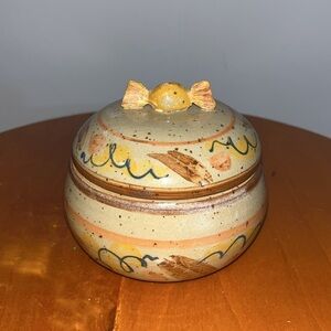 Handmade, possibly vintage, ceramic trinket box with a lid.